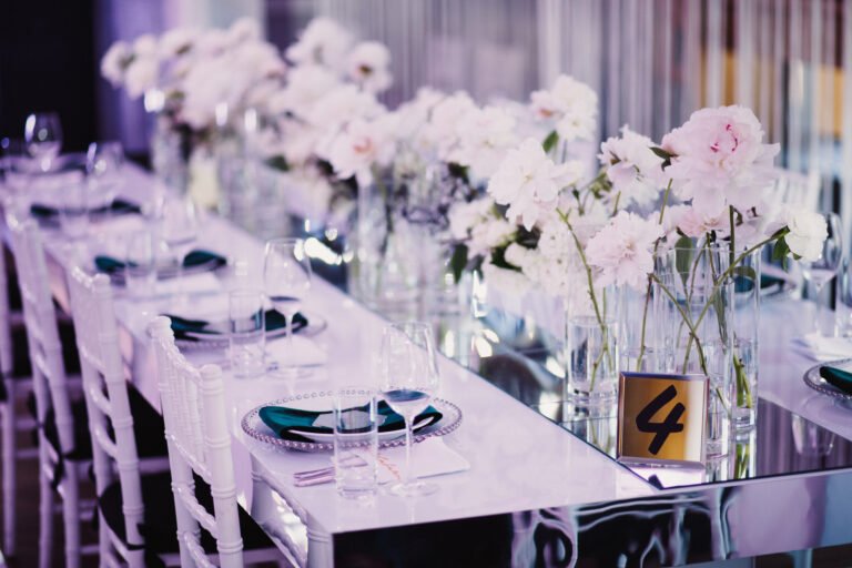 Wedding decor in restaurant with silverware, glassware, chair and table rentals